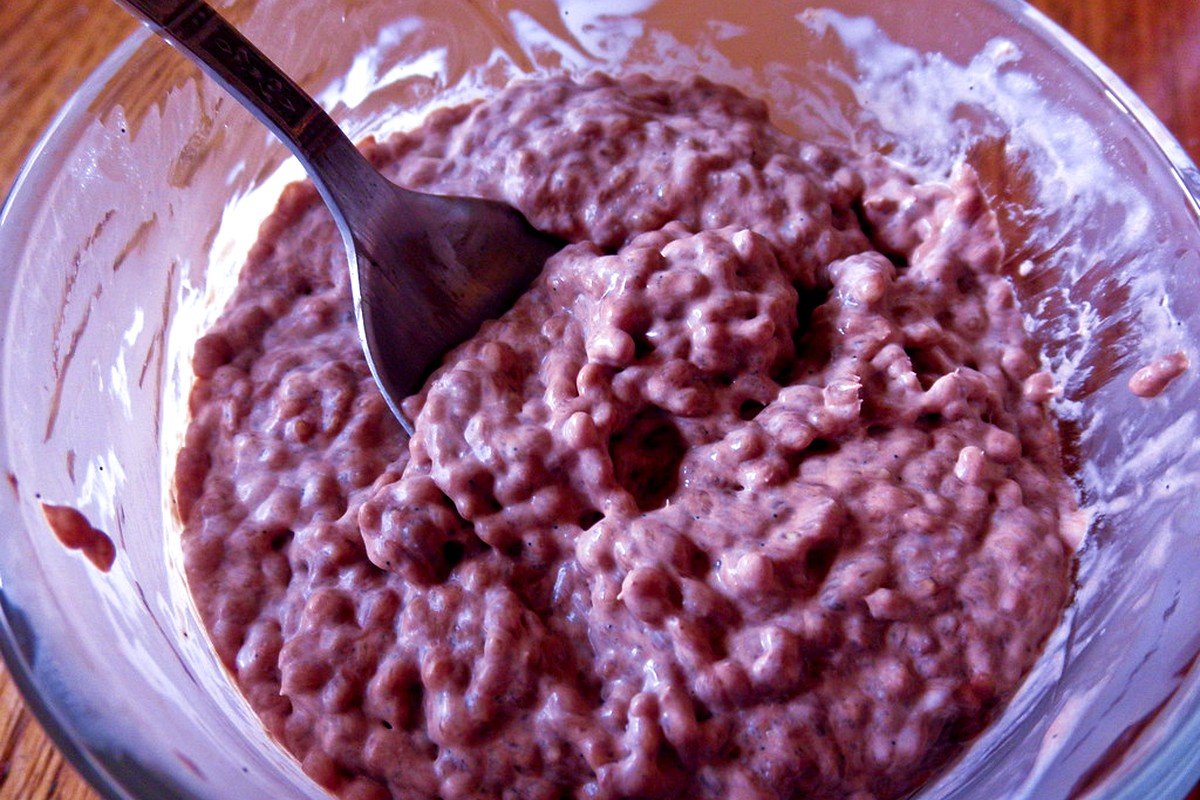 STEP 02 for Creamy Vanilla Almond High-Protein Overnight Oats: Whisk Whey Isolate into Almond Milk